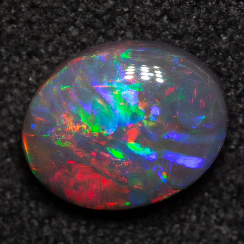 0.91 ct black opal 7.6x6x3mm - Image 2
