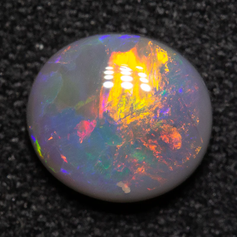 0.91 ct black opal 7x6.5x3mm - Image 2