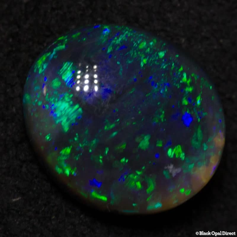 0.91 ct black opal 7x6x3mm - Image 4