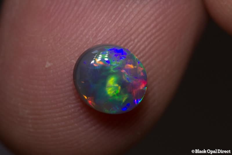 0.91 ct dark crystal opal 7x6.1x3mm - Image 2
