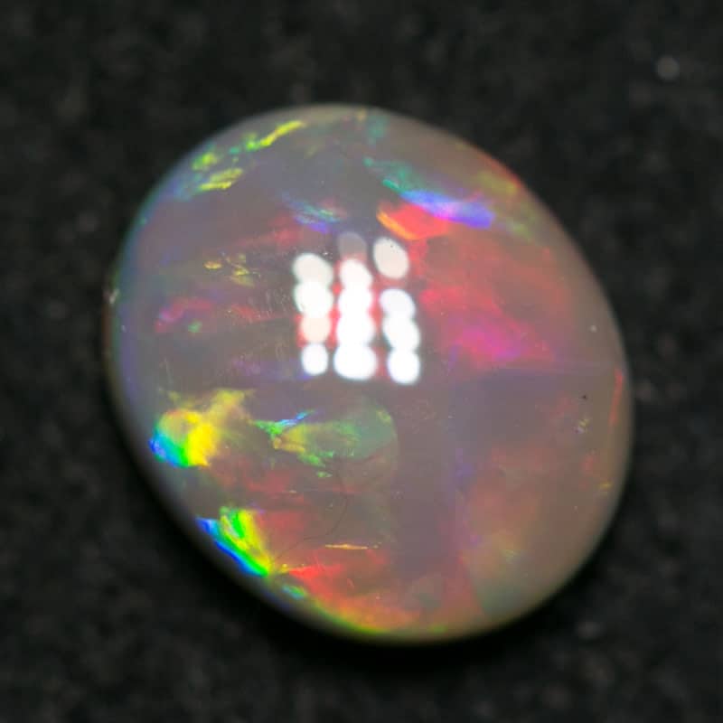 0.91 ct dark opal 7x6x3mm - Image 2