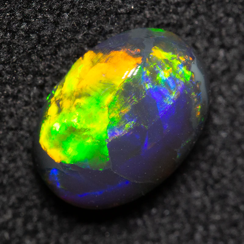 0.93 ct black opal 7.6x5.6x3.5mm - Image 2