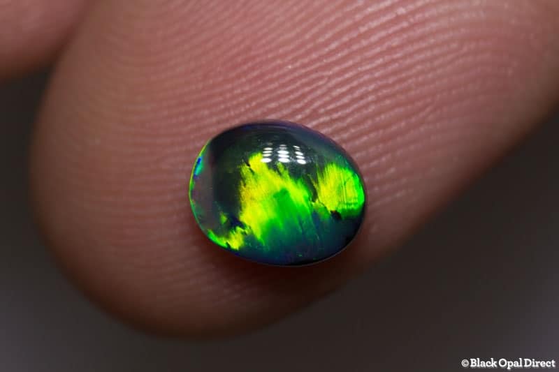 0.93 ct gem black opal with rolling flash pattern 7.9x6x3mm - Image 2