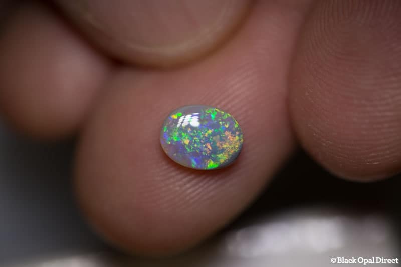 0.93 ct semi black opal 8x6x3mm - Image 2