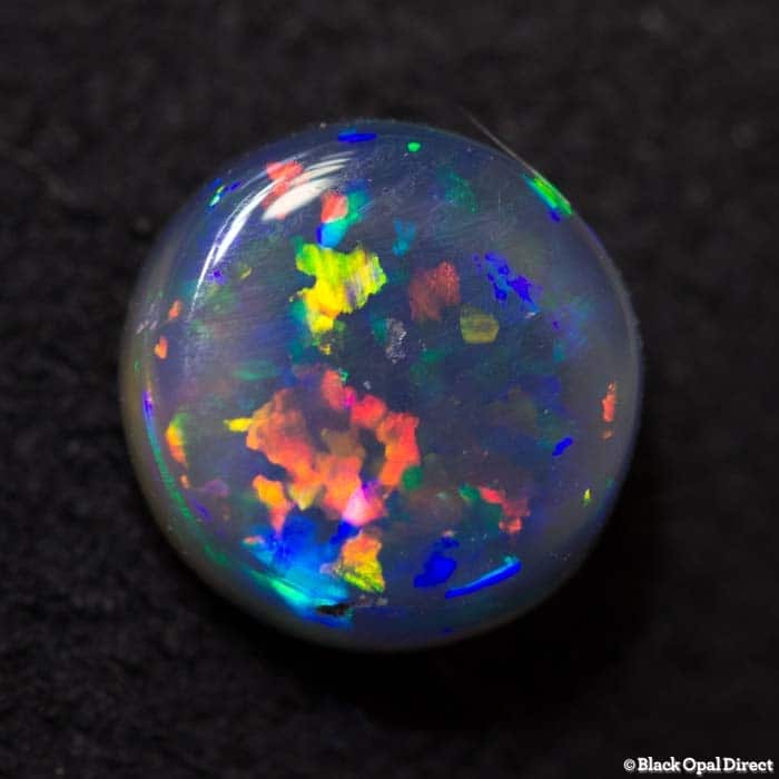 0.94 ct black crystal opal 6mm round x3mm - Image 4