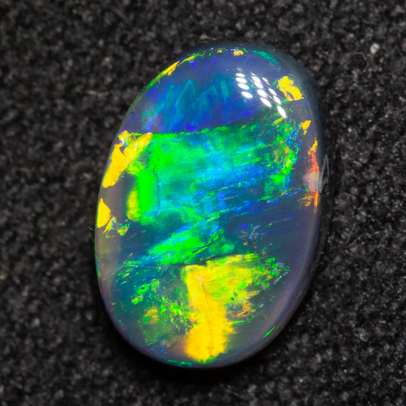 0.94 ct black opal 8x5.6x2.9mm - Image 2