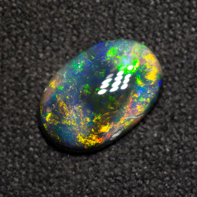 0.94 ct black opal 9x6.2x2.6mm - Image 2
