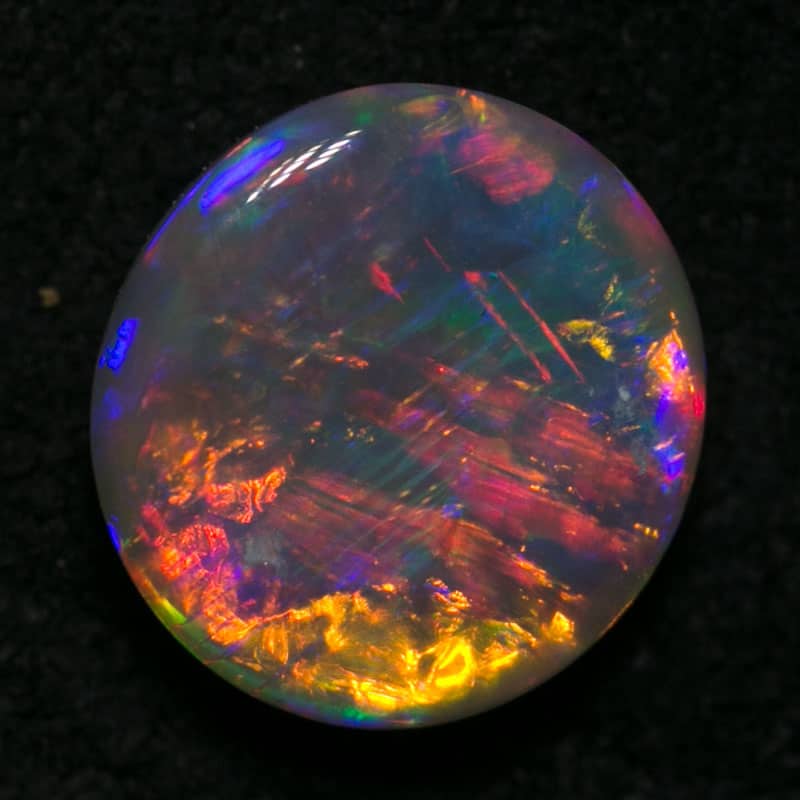 0.94 ct gem double sided crystal opal 7mm round x 3mm - Image 2