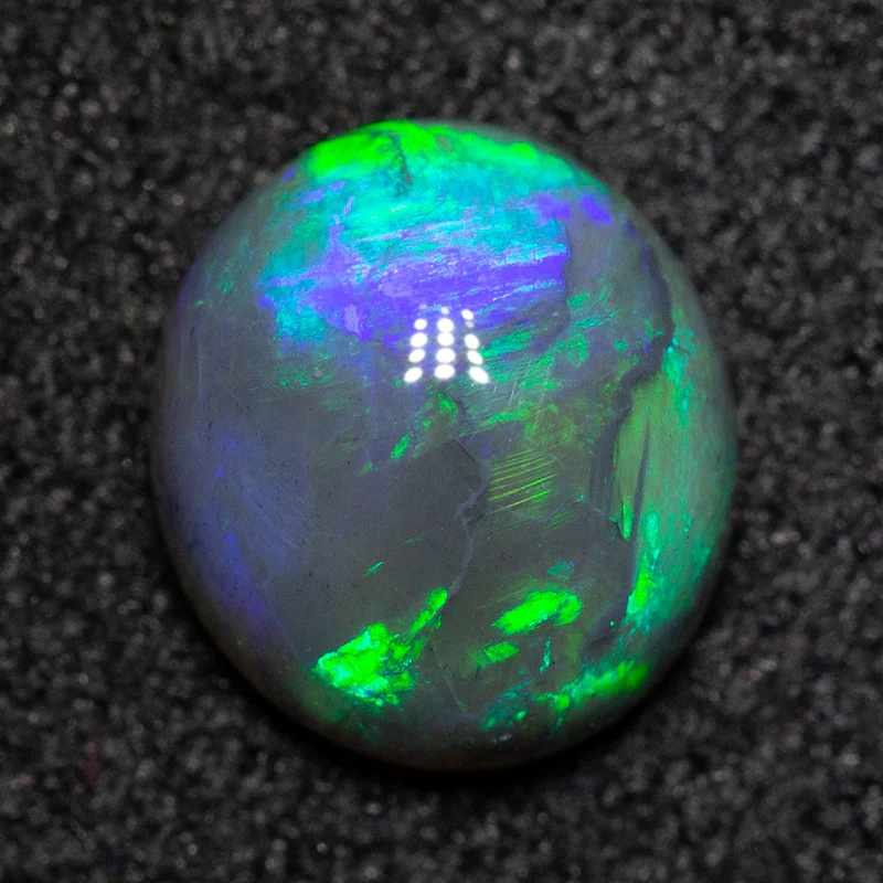 0.98 ct black opal 7.3x6.6x3.4mm - Image 2