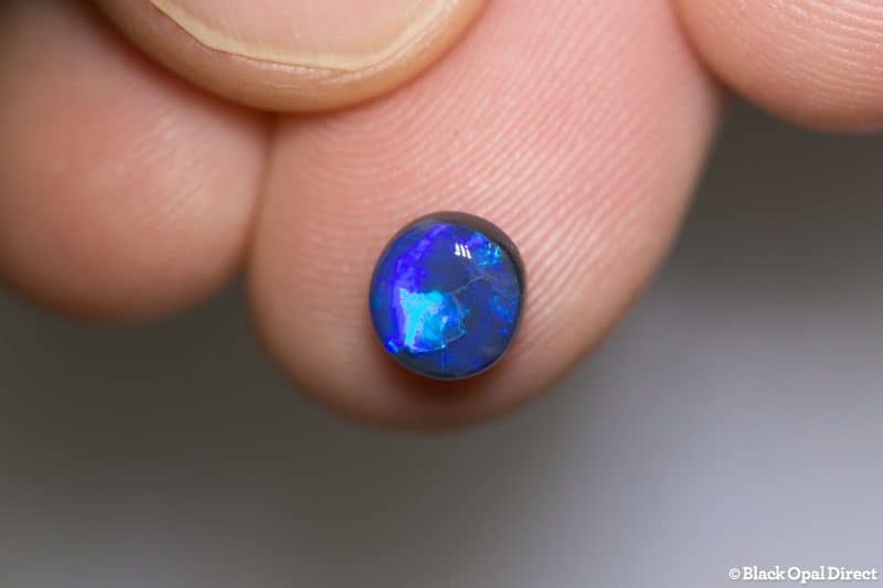 0.98 ct black opal 7x6.5x3mm - Image 2