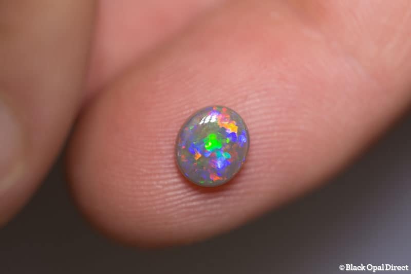 0.98 ct semi black opal 7x6x3mm - Image 2