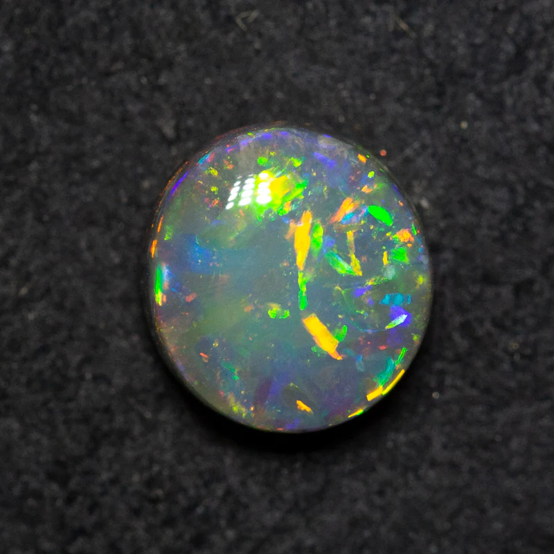 0.99 ct black opal 6.9x6.4x3.6mm - Image 2