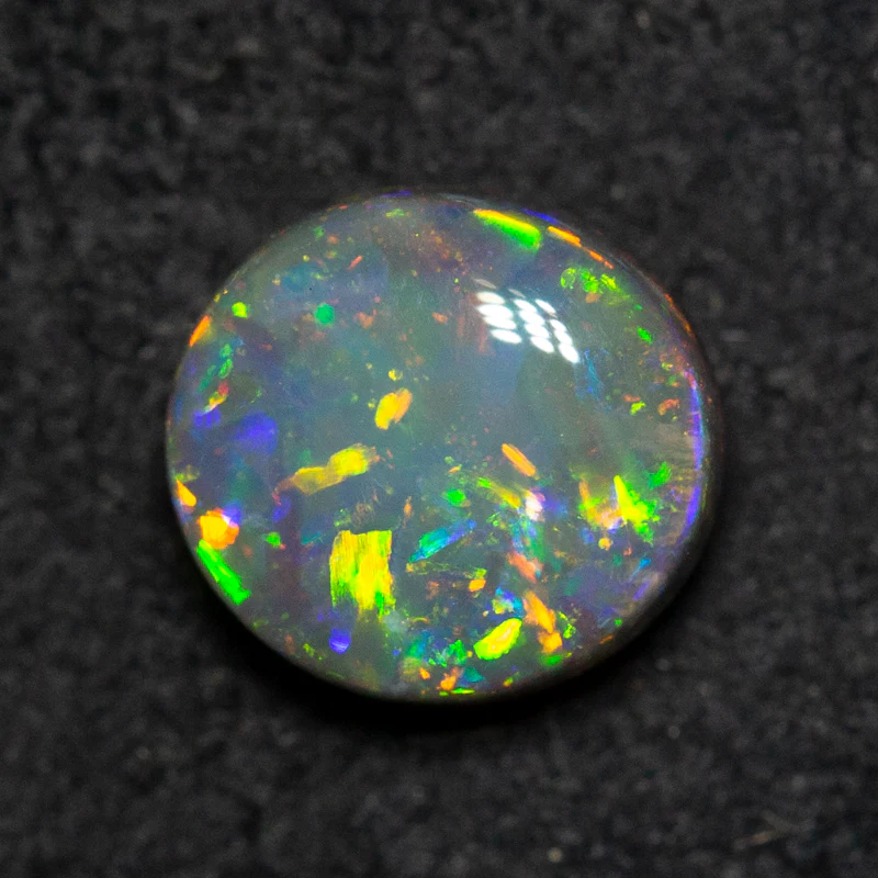 0.99 ct black opal 6.9x6.4x3.6mm - Image 3