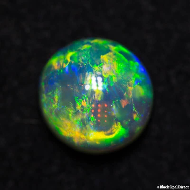0.99 ct gem double sided crystal opal 6mm round x 4mm - Image 2