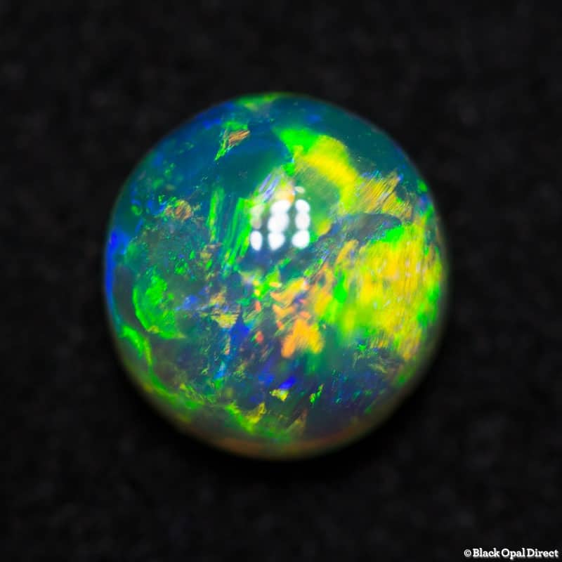 0.99 ct gem double sided crystal opal 6mm round x 4mm - Image 4