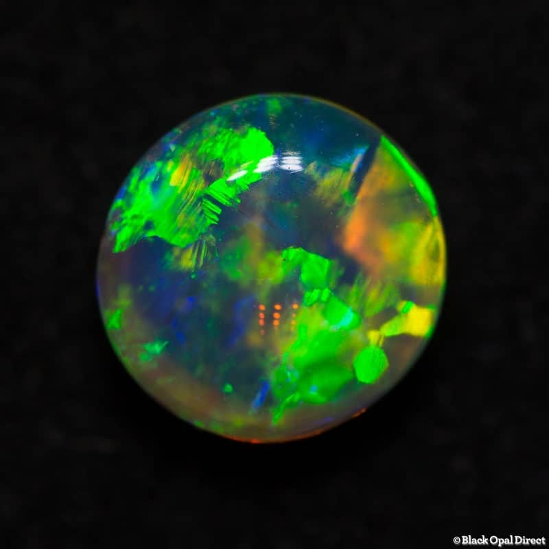 0.99 ct gem double sided crystal opal 6mm round x 4mm - Image 5
