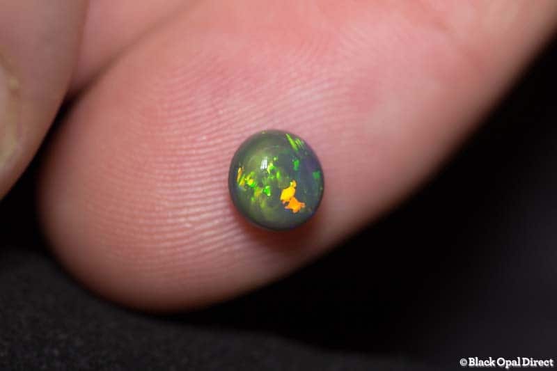 1.06 ct black opal 6mm round x4mm - Image 2