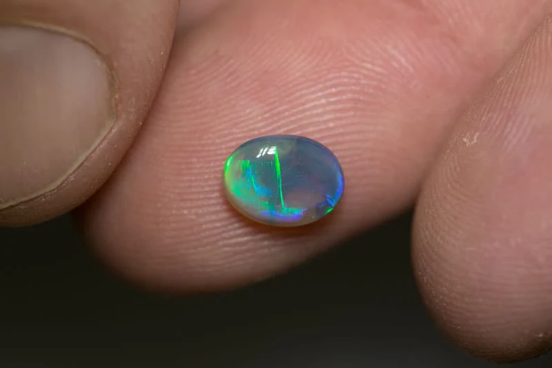 1.06 dark crystal opal 8x7x2mm - Image 3