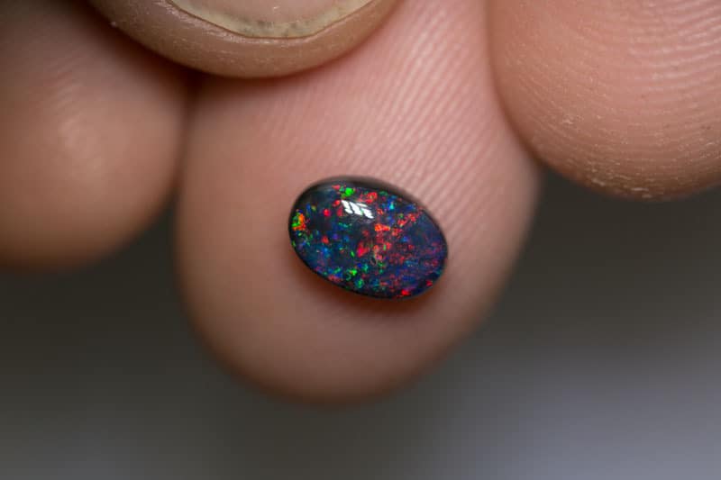 1.13 pigeon blood red black opal 8x5.5x3.5mm - Image 3