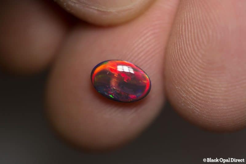 1.19 ct red on black opal gem 9x6x3mm - Image 6