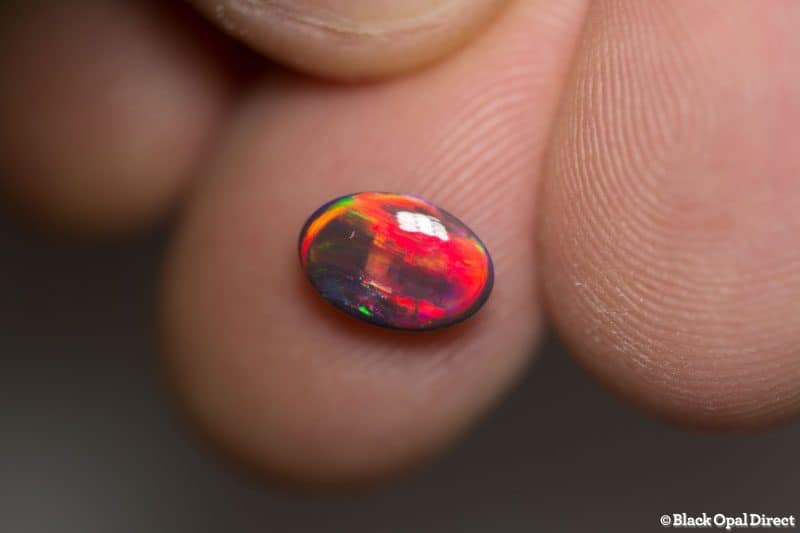 1.19 ct red on black opal gem 9x6x3mm - Image 7