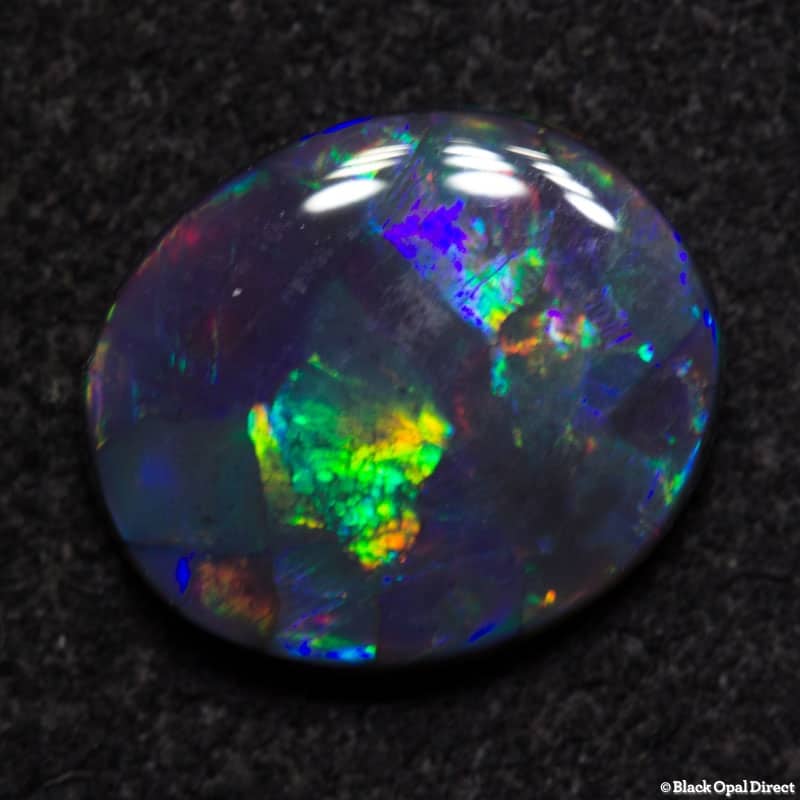 1.24 ct gem black opal 9x7.5x2mm - Image 4