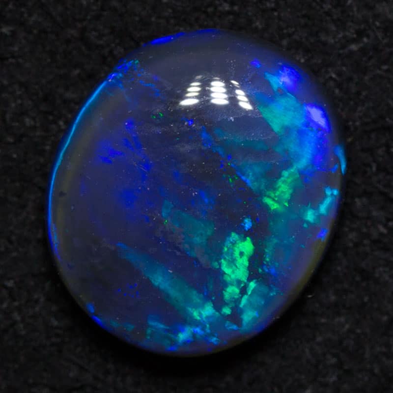 1.29 ct black opal 8.4x7.2x3.2mm - Image 2
