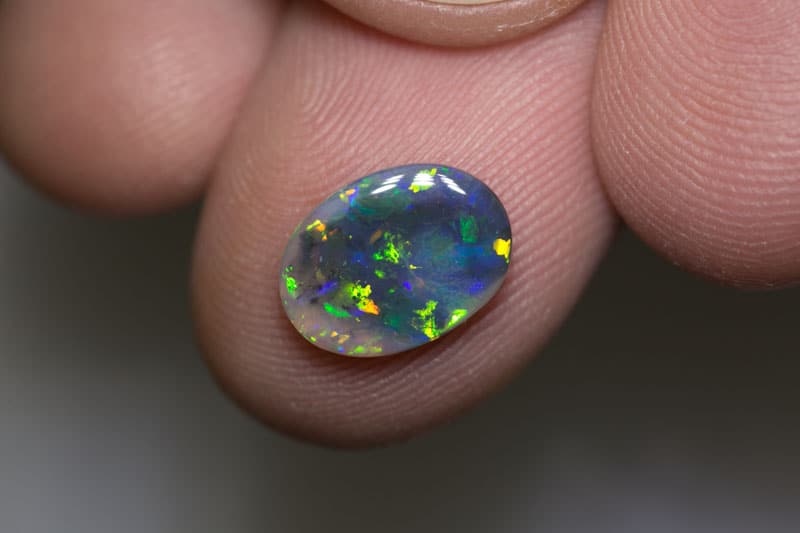 1.35 ct black opal 11x8x2mm - Image 2
