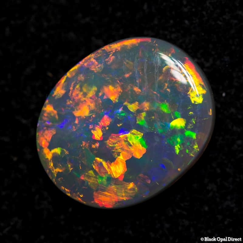 1.38 ct orange green crystal opal 10x8x2mm - Image 2