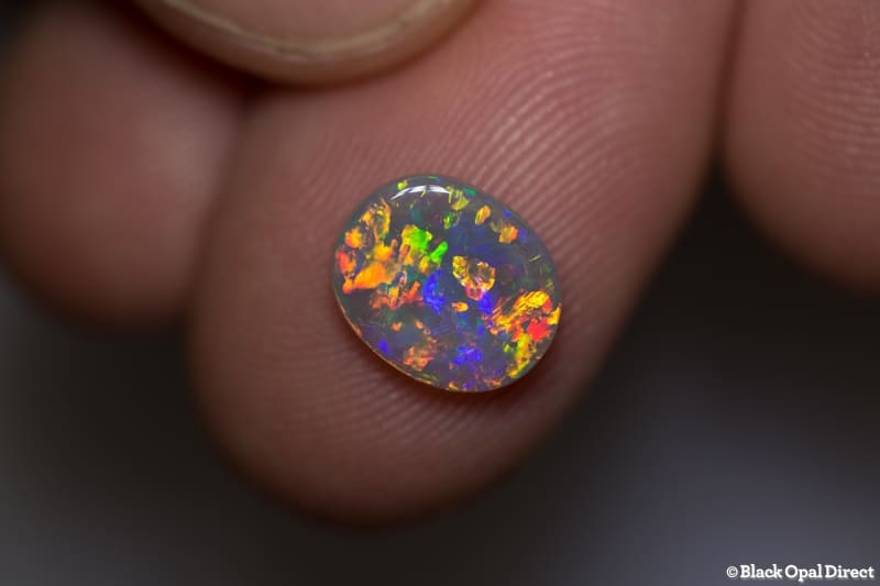 1.38 ct orange green crystal opal 10x8x2mm - Image 4