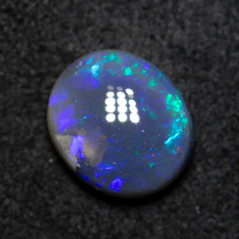 1.65 ct black opal 8.4x7.3x4.2mm - Image 2