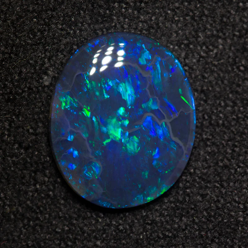 1.82 ct black opal 11.4x9.5x2.4mm - Image 2