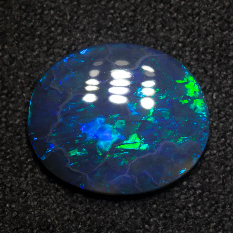 1.82 ct black opal 11.4x9.5x2.4mm - Image 3