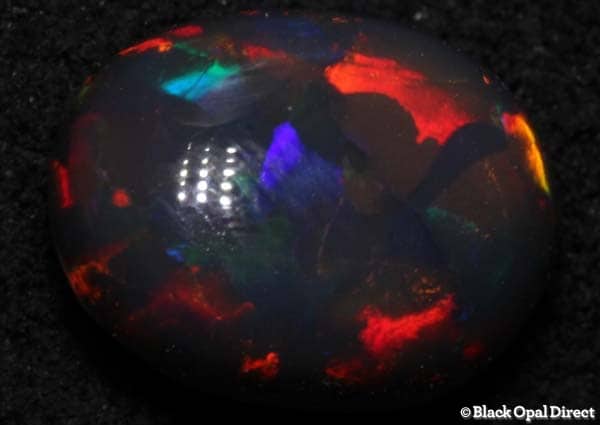 1.84 ct high domed gem black opal 9x7x5mm - Image 2