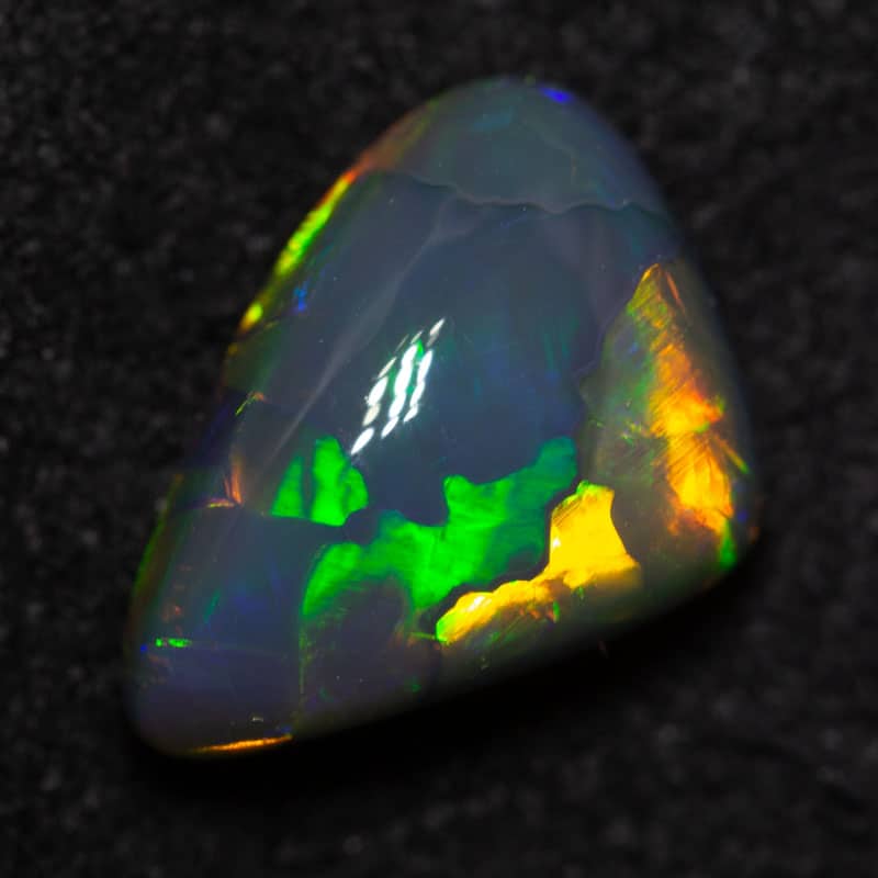 1.98 ct black opal 11x7.5x4mm - Image 2
