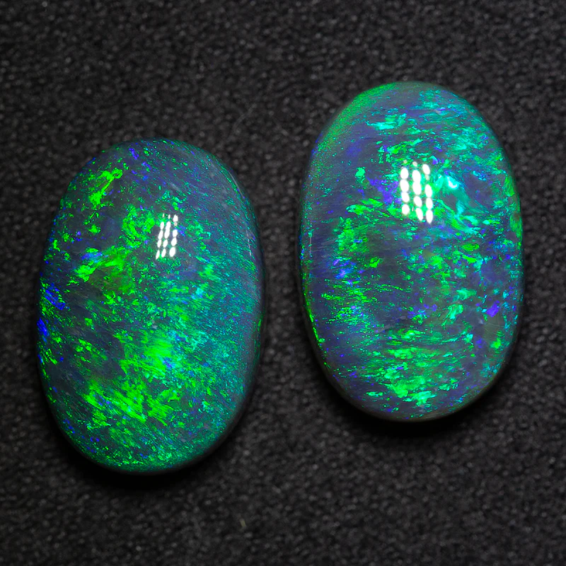 14.70 ct black opal pair 15.3x10.4x7mm - Image 2