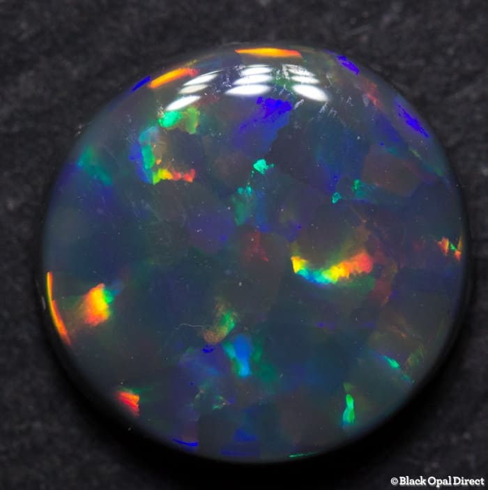 2.08 ct Harlequin black opal 9.5mm round x3mm - Image 3