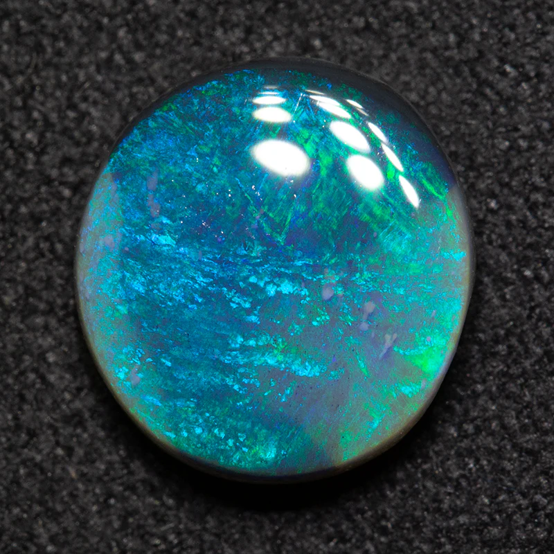 2.30 ct black opal 10.2x9.5x3.8mm - Image 2