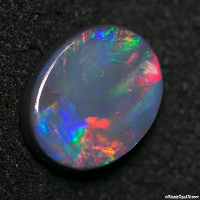 2.59 ct black opal gem 11.5x9x3mm - Image 2