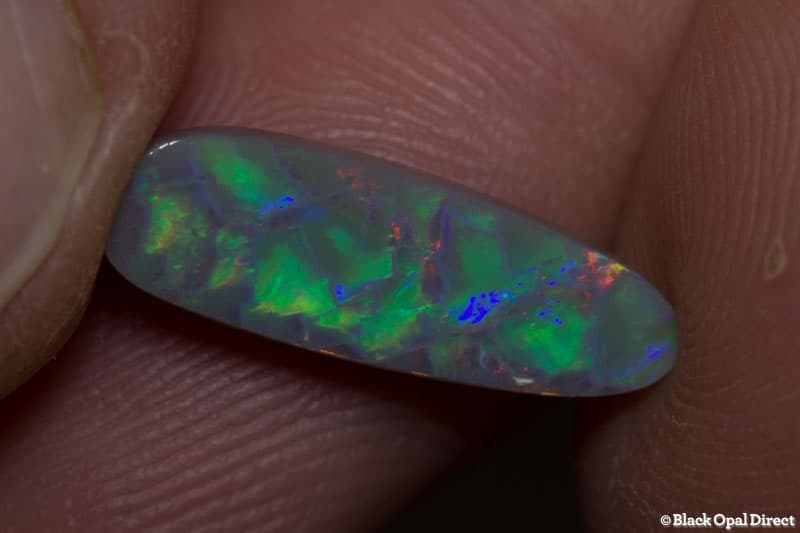 2.60 ct baroque semi black opal 17x6x3.5mm - Image 8