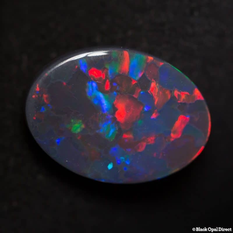 2.85 ct gem red blue on black opal 13x9x3mm - Image 3