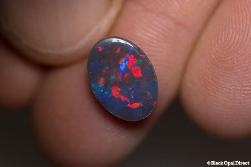 2.85 ct gem red blue on black opal 13x9x3mm For Al - Image 2