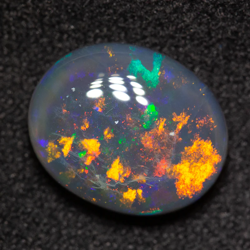 2.86 ct black opal 11x9x4mm - Image 2