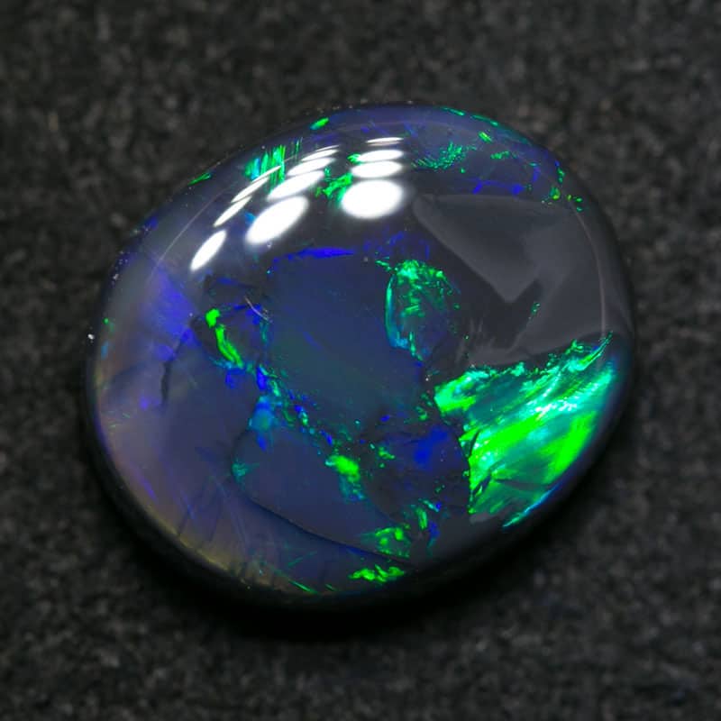 2.90 ct black opal 10x9x4mm - Image 2