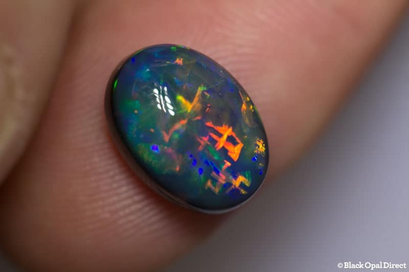 5.17 ct gem black collectors opal with Chinese Writing 13x9.5x6.5mm - Image 2