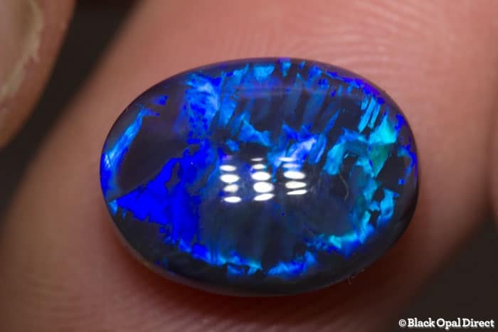 5.85 ct blue opal with chinese writing 14x10.5x6mm - Image 2