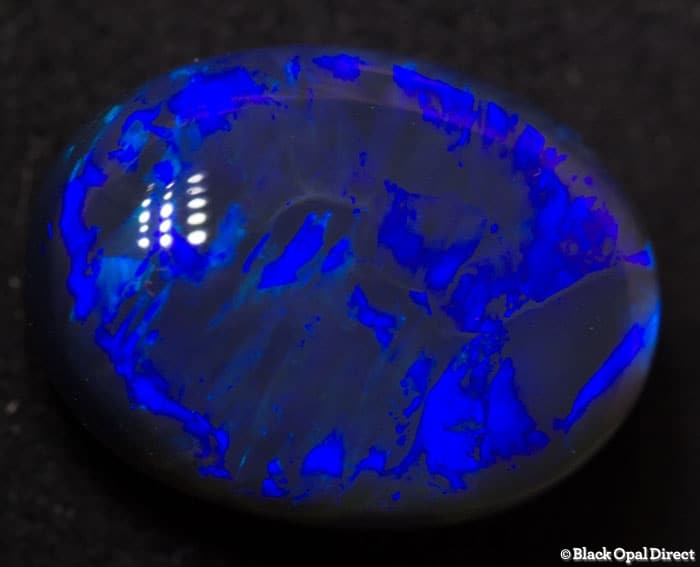 5.85 ct blue opal with chinese writing 14x10.5x6mm - Image 4