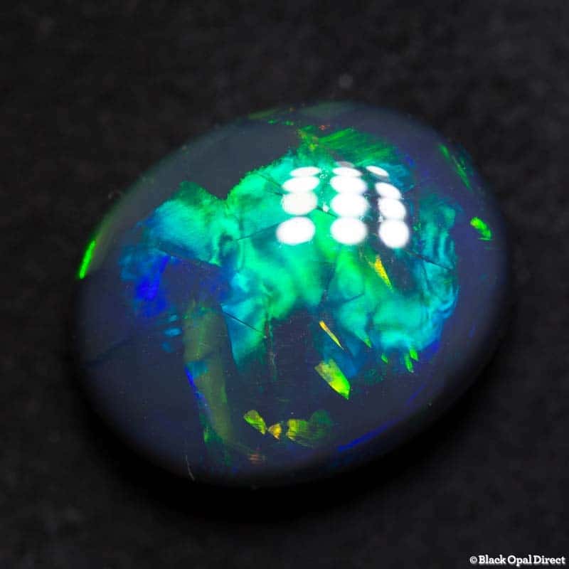 8.79 ct black opal gem with Chinese writing 15x12x7mm - Image 4
