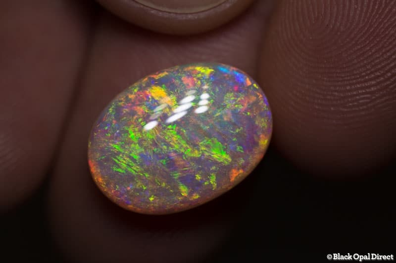 9.48 ct orange green gem crystal opal 17x12.5x7.5mm - Image 2